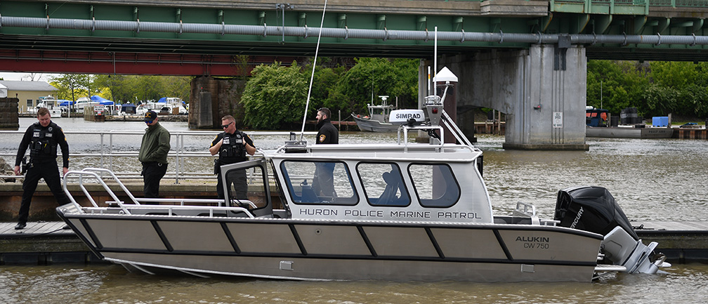 Marine Patrol Boat at Dock with Officers